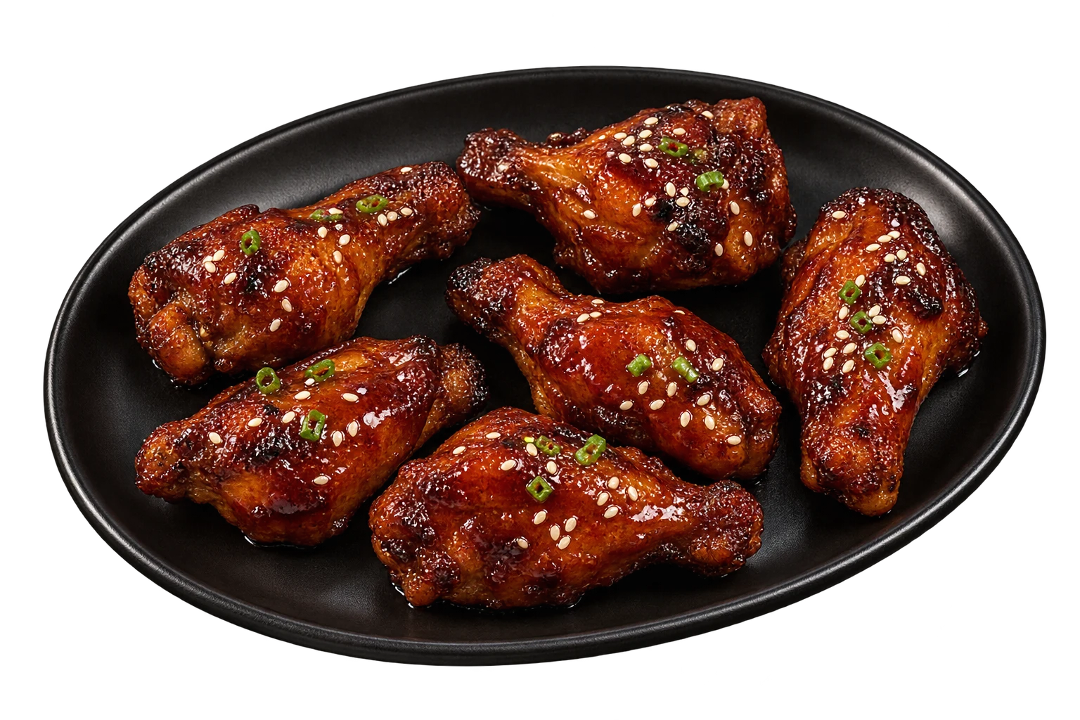 Composición de seis alitas bañadas en salsa BBQ sobre un plato negro